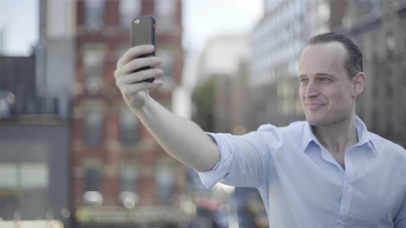 Man taking selfie with smart phone