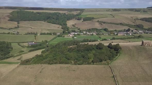 Forward tracking aerialing across the copse beside St Catherine's Chapel near the village of Abbotsb