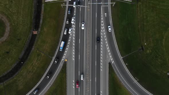 Automobiles Drive at High Speed Along Multilevel Highway