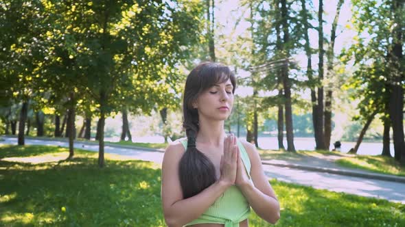 Beautiful Brunette Woman Sportswear Trains Yoga Asana Green Juicy Grass Purple Mat Barefoot Doing