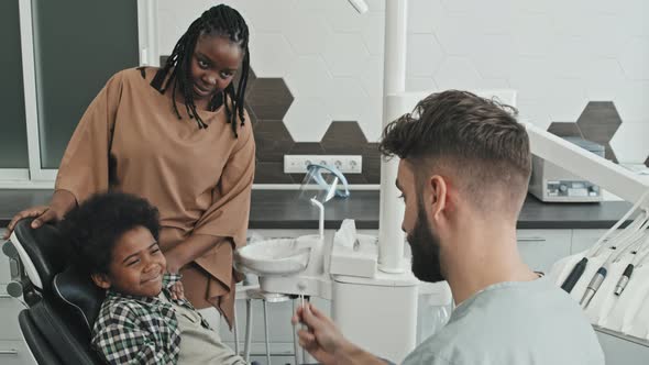 Woman Picking up Son in Dentist Office