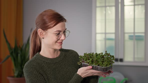 Healthy Vegan Nutrition Portrait of Young Woman Holding Microgreens in Her Hands