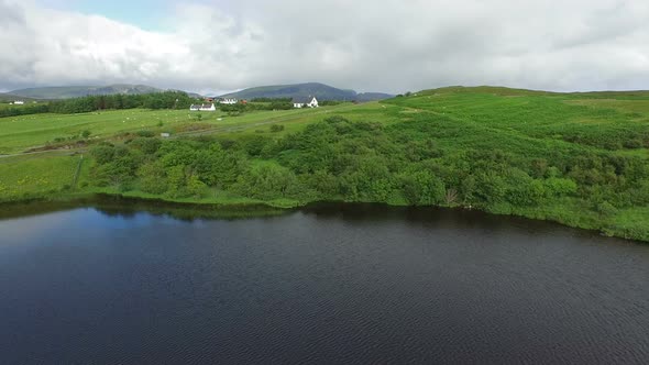 Aerial view of a green scenery near a lake