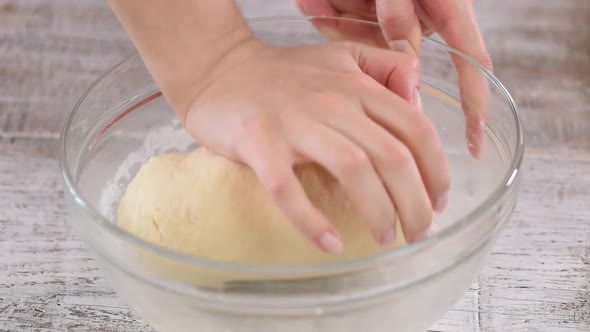 Cooking and Home Concept, Close Up of Female Hands Kneading Dough at Home. Close-up.