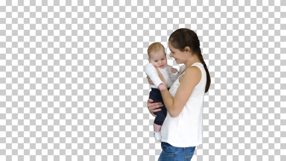 Young mother holding her baby in hands and walking, Alpha Channel