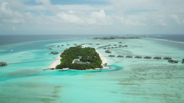 Aerial Drone View of a Beautiful Atoll or Island with a Resort in the Maldives