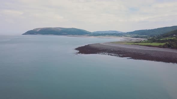 Wide shot aerial of the valley around the village of Porlock Somerset. Amazing beatiful coast, in th