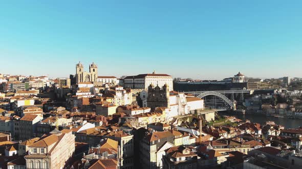 Fly over downtown Porto historical buildings on sunny day. Oporto, Portugal