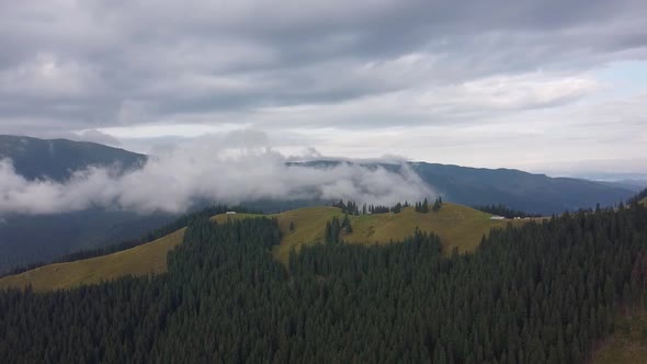 Cloud Over Mountain Peak In Mountains, Aerial View