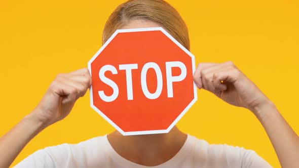 Woman Closing Face With Stop Sign, Protest Against Sexual Trading and Slavery