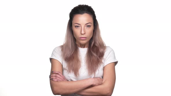 Portrait of Angry Strict Woman in Casual Tshirt Holding Index Finger on Lips Asking Not to Disturb