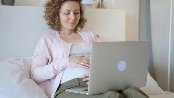 Pregnancy, Technology, People And Leisure Concept. Pregnant Woman With Laptop.