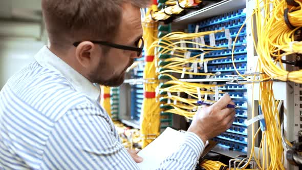 Engineer Working in Data Room