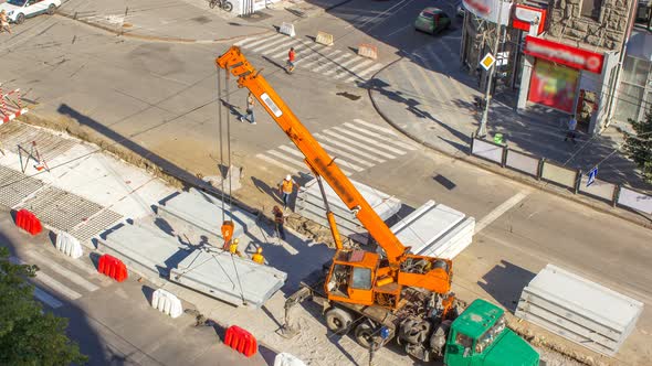 Installing Concrete Plates By Crane at Road Construction Site Timelapse.