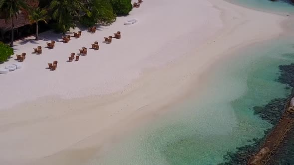 Sunny panorama of marine tourist beach journey by ocean and sand background near reef