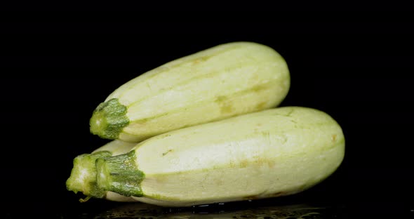 Fresh Zucchini on the Table Slowly Rotating. 