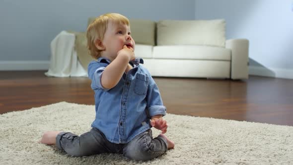 Blond Baby Boy Chewing on Finger