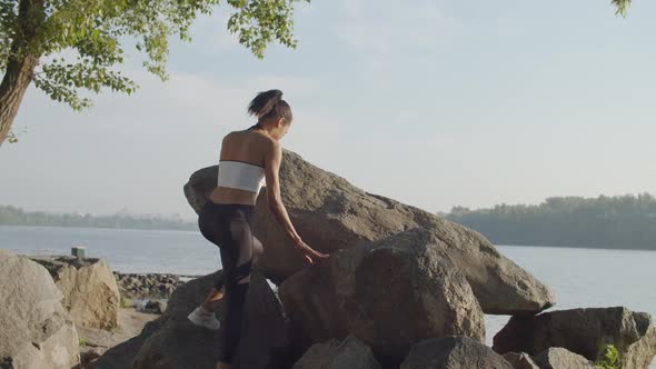 Sporty Female Athlete Enjoying Nature at Sunrise