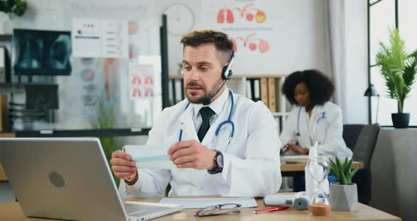 Doctor in Wireless Headset Telling to Online Audience About the Need to Wear Protective mask