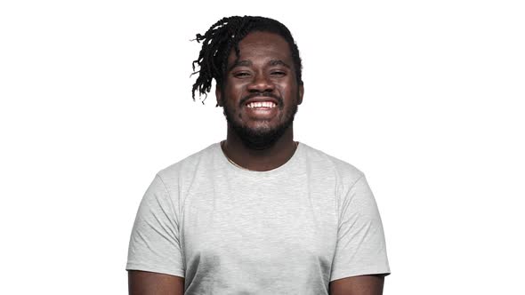 Portrait of Vivacious African American Man with Big Smile Laughing and Expressing Joy Isolated Over