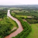 Aerial view over terraced rice paddies with the river in the valley - VideoHive Item for Sale
