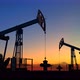 Two oil pump jacks extracting crude oil under beautiful sunset sky - VideoHive Item for Sale