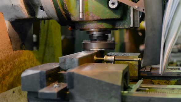 Vertical Knee-type Milling Machine Processes the Metal Workpiece.