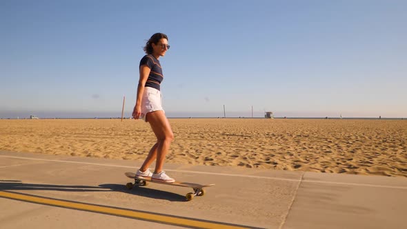 Young Active Woman Enjoyed Riding And Dancing On Skateboard At Summer. - close up