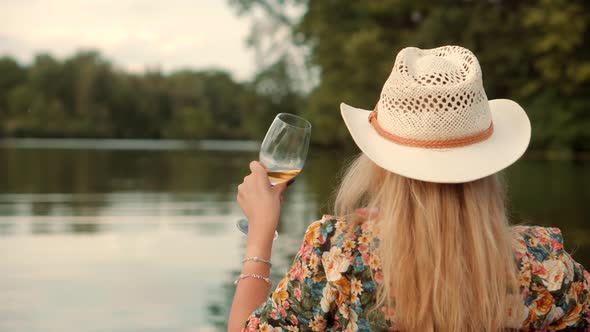 Pretty Lady Relaxing After Hard Working Day And Celebrating Holidays Vacation. Drinking White Wine.