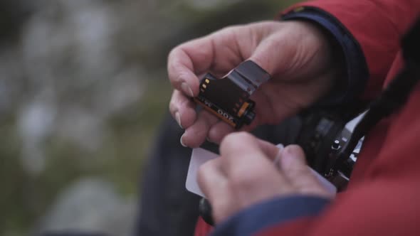 Hiker Holding Camera Film Spool