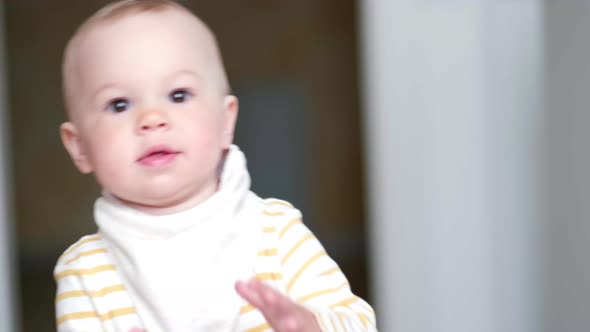 Little Baby Dancing on Kitchen at Home Listening Childrens Songs