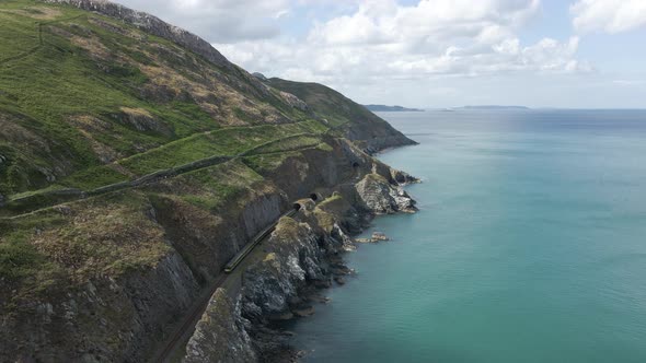 Train Passing By And Exiting A Tunnel With Cliff Walk Bray To Greystones Near Dublin And Bray Town I
