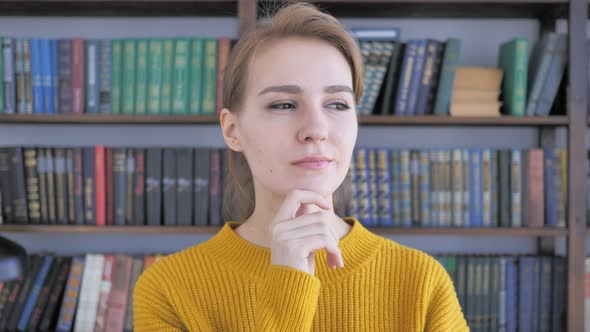 Portrait of Thinking Woman in Office