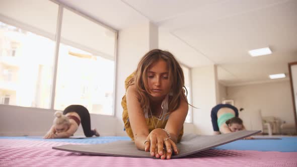 Women Do Yoga  Do an Exercise for the Back and Spine