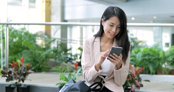 Business woman use of cellphone in office 