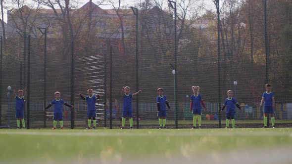 Kids Soccer Players Training on Urban Playground
