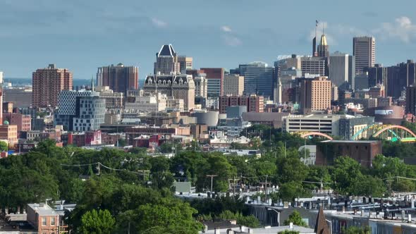 Aerial pan, panorama of Baltimore Maryland downtown urban city skyline in USA on sunny summer day.