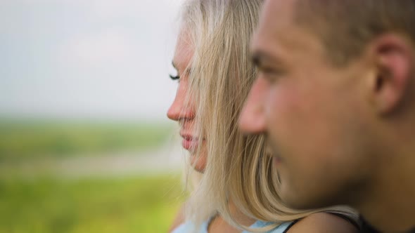 Pretty Blonde Lady with Man Stands Together at Romantic Date