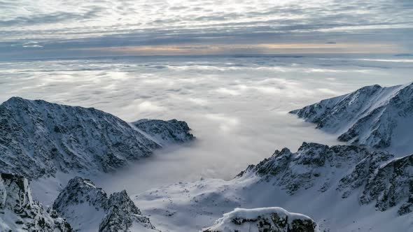 Foggy Clouds in Winter Mountains