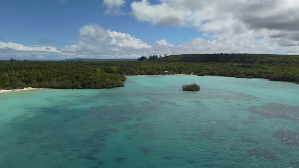 Tropical New Caledonia island turquoise sea and idyllic quiet beaches, 4K aerial