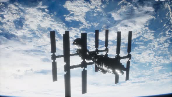 International Space Station in Outer Space Over the Planet Earth alt