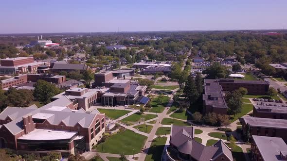 Forward panning aerial of Hope College area in Michigan on sunny day