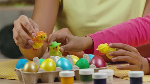 Mom and Daughter with Funny Bunny Ears Have Fun with Decorative Chicks