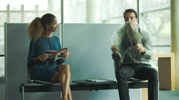 Patients chatting in doctors office waiting room