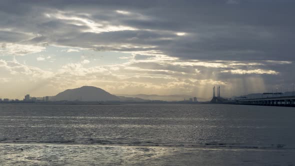 Timelapse sun ray over Penang Bridge