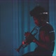 A young trumpeter plays the trumpet in his apartment - VideoHive Item for Sale