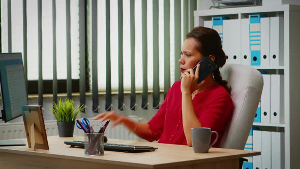 Talking on Phone in Business Office