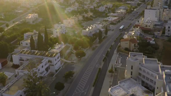 Tourist Bus Driving on City Streets, Real Estate at Seaside Resort, Aerial View