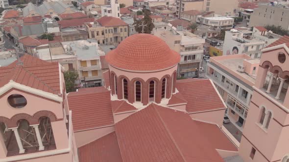 Beautiful Pink Cathedral of Virgin Mary Pantanassis in Limassol, Cyprus - Aerial drone 4k
