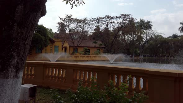 Uncle Ho's Fishpond in the public Presidential Palace grounds Hanoi Vietnam, Pan right reveals shot